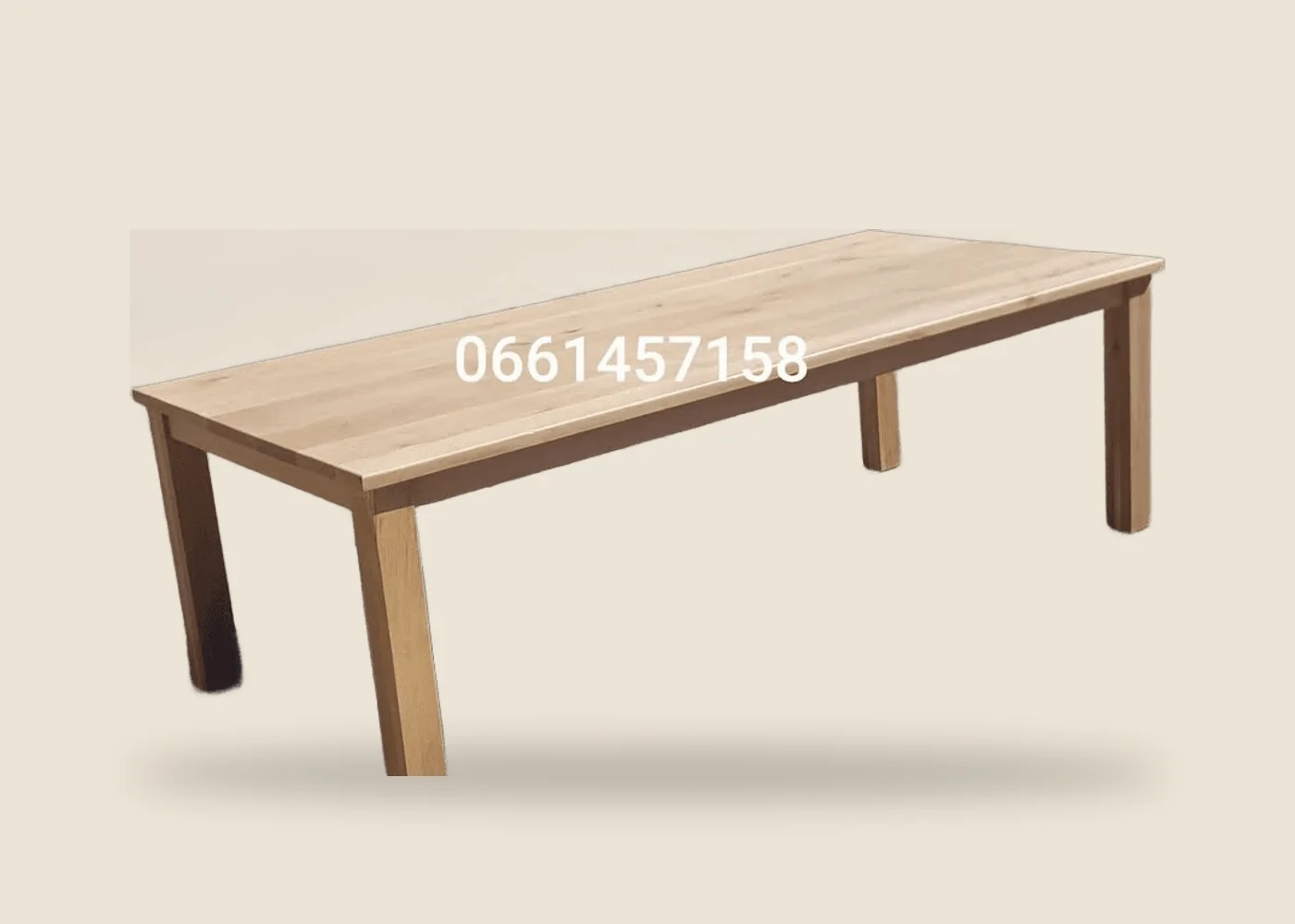 A solid oak dining table, 2.4 metres long
